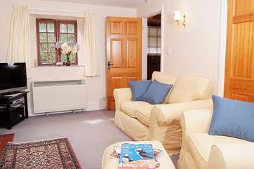 The sitting-room with its comfy sofa and chairs